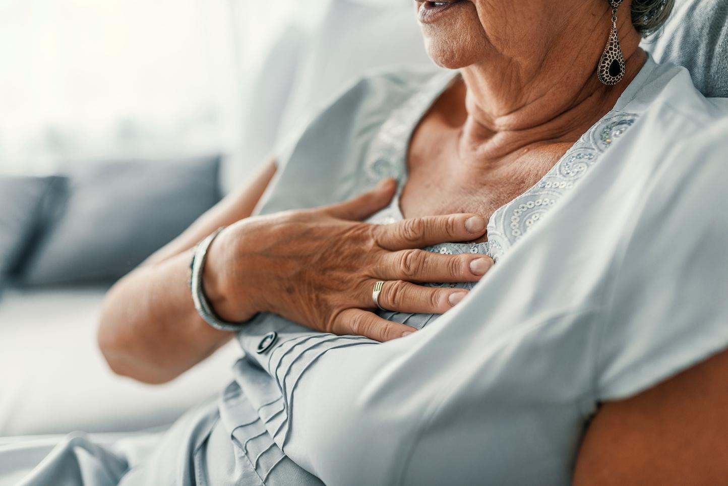 Senior woman suffering from heartburn