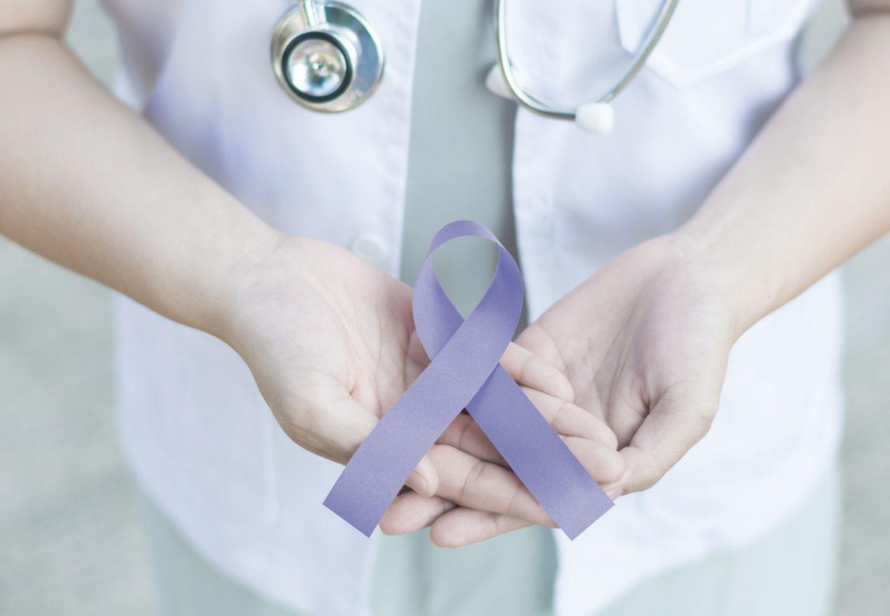 Periwinkle blue ribbon awareness in doctor hand for Acid Reflux